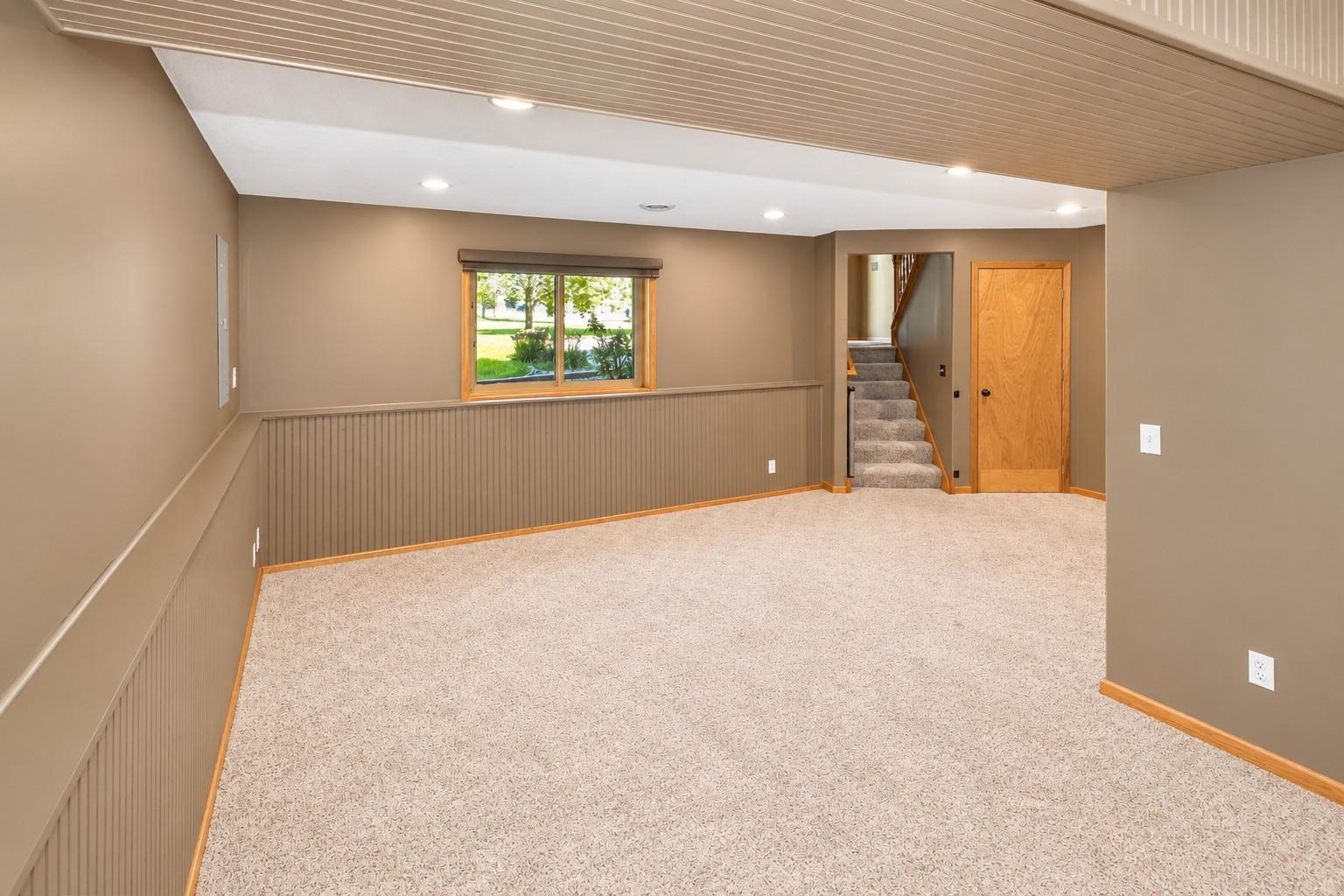 Lower level L shaped family room.jpg