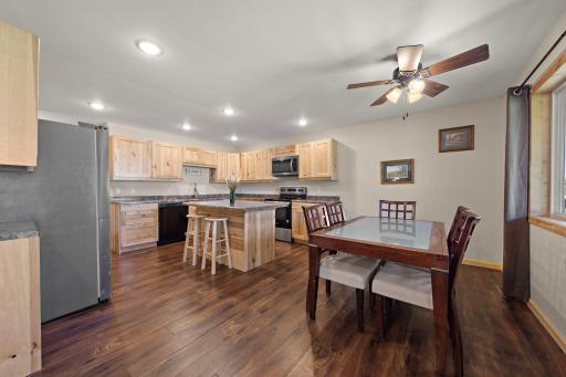 The informal dining area is right off of the kitchen and main living area to the right of the front door upon entry into the home.