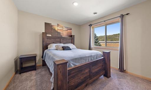 The second bedroom is also on the upper level and features a view of the front yard.