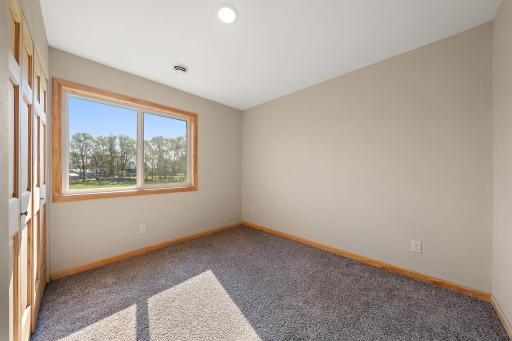 The third bedroom is on the upper level and has a closet on the left.
