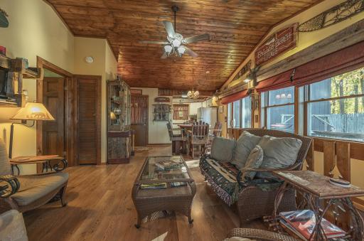 Additional views of living room towards kitchen and dining