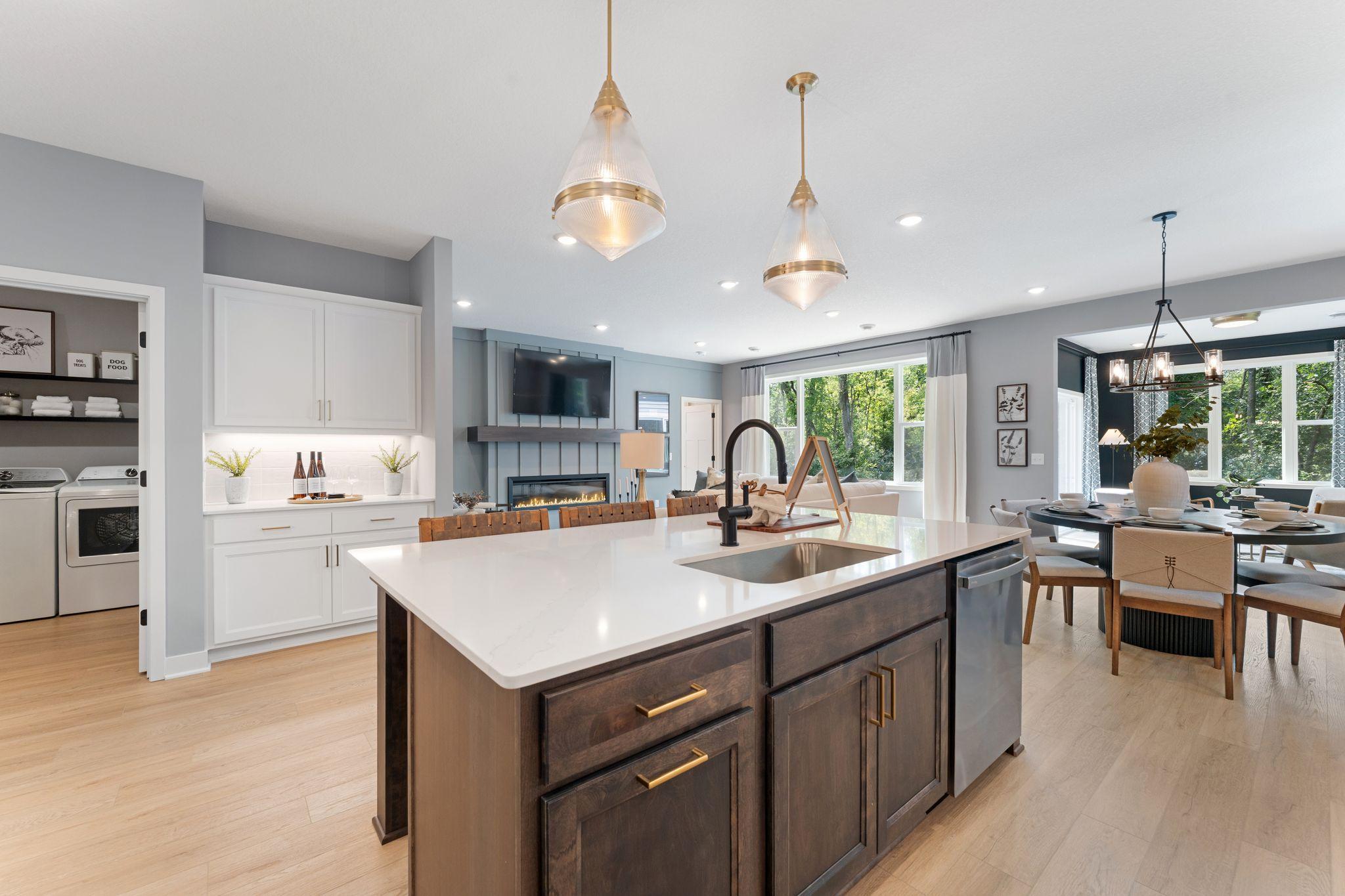 This generous island keeps everyone connected whether you're hosting dinner helping with homework, or catching up over coffee *photo of model home (design options may vary)