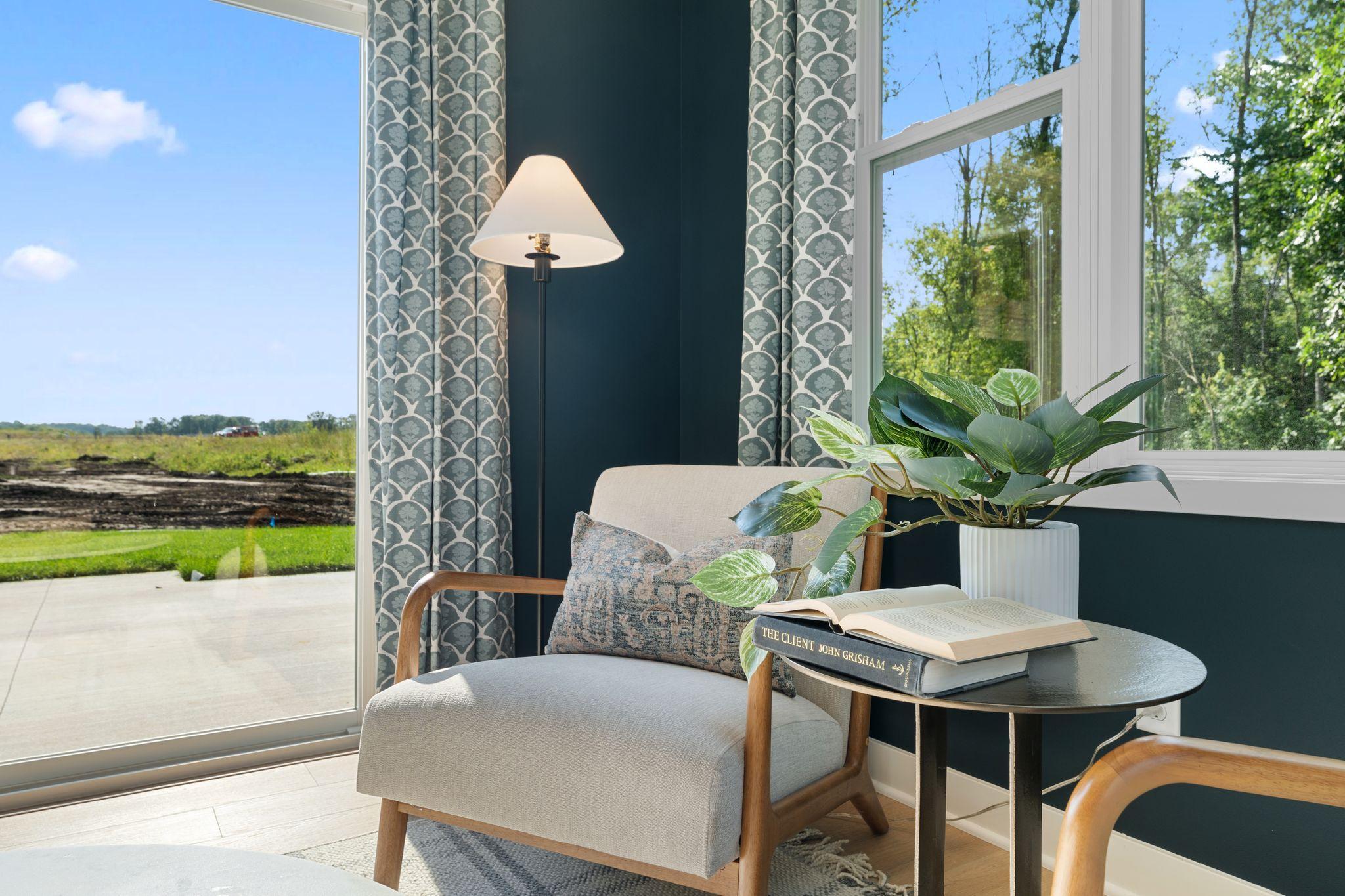Sneak away with a coffee, a good book, or a quiet moment in this cozy morning retreat filled with natural light *photo of model home (design options may vary)