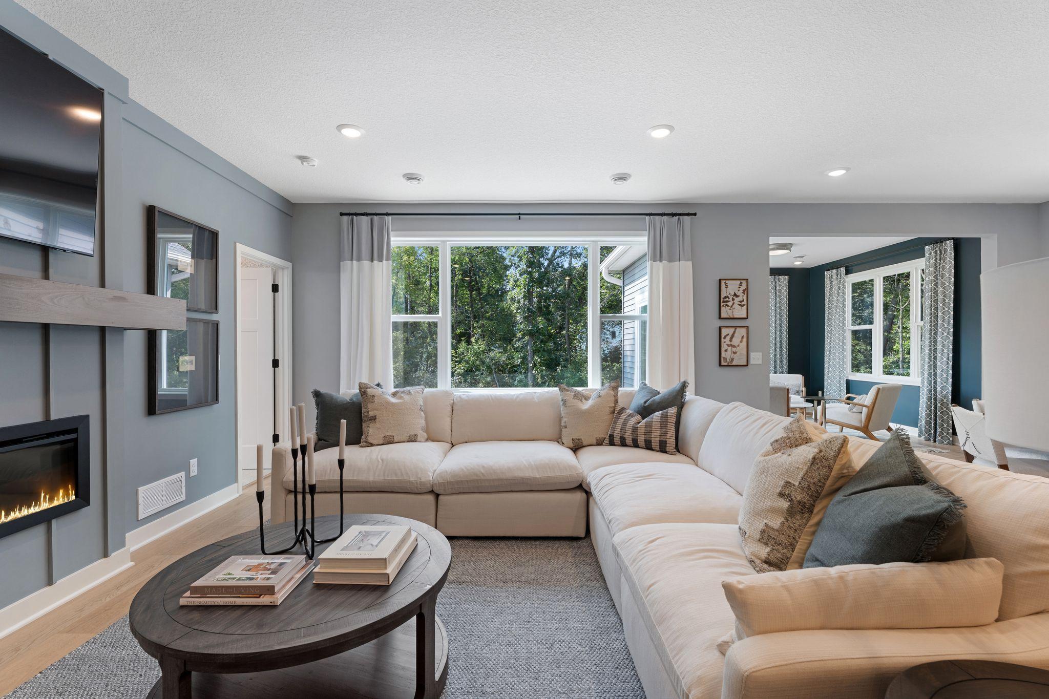 Stretch out settle in, and make yourself at home - this inviting living room was made for slow mornings and cozy nights in *photo of model home (design options may vary)