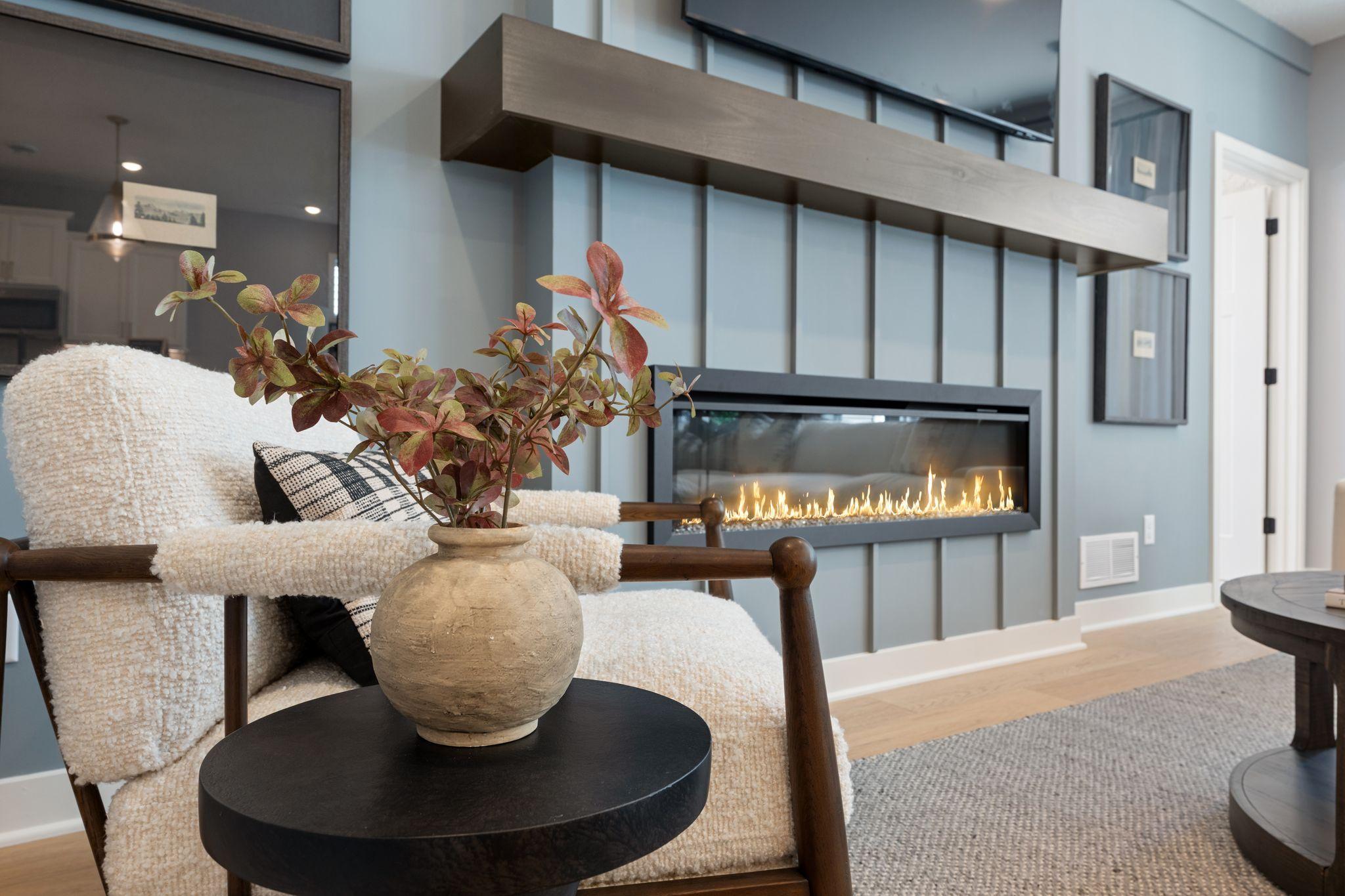 Curl up fireside with your favorite drink and enjoy a living space that instantly feels like home *photo of model home (design options may vary)