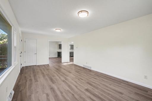 Living Room looking into Kitchen and Dining Room