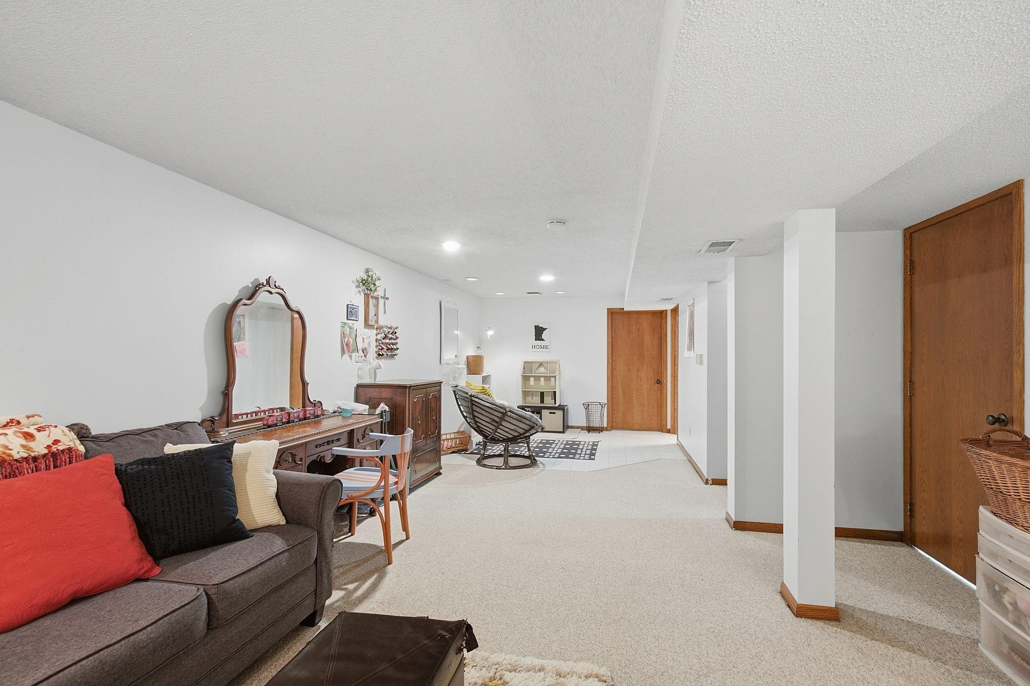 Lower level Family room. Also 3/4 bathroom, Laundry room and a lot of storage space too.
