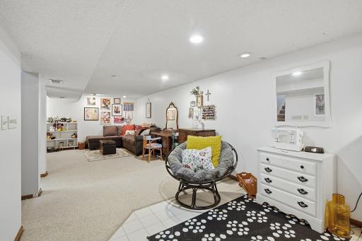 Lower level family room area. Movie night, sewing, crafts, nintendo....and more! What will you put in this area?