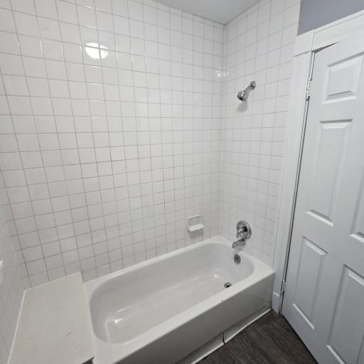 Upper level full bathroom with brand new tile tub/shower surround.