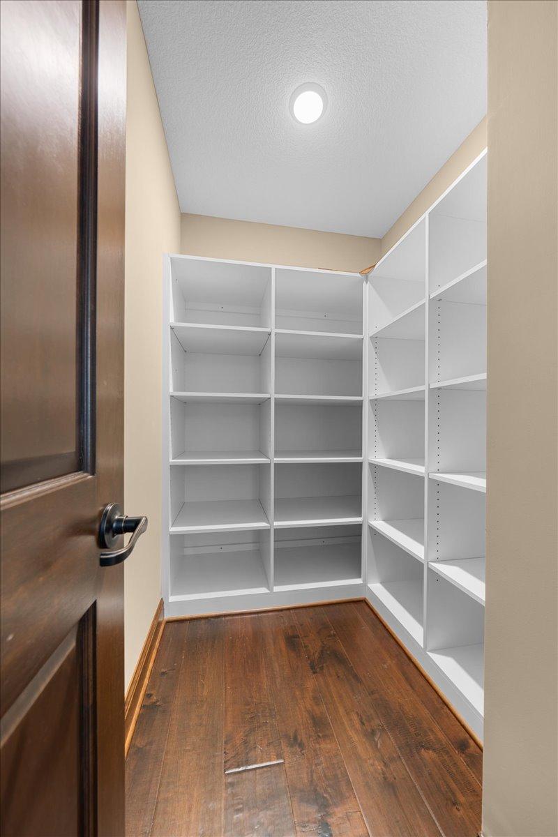 Walk-in-storage closet behind bar.