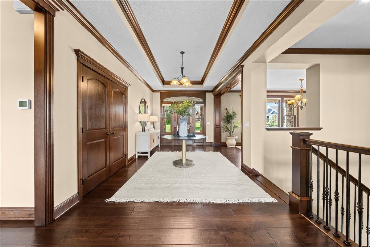 Foyer area with coat closet.