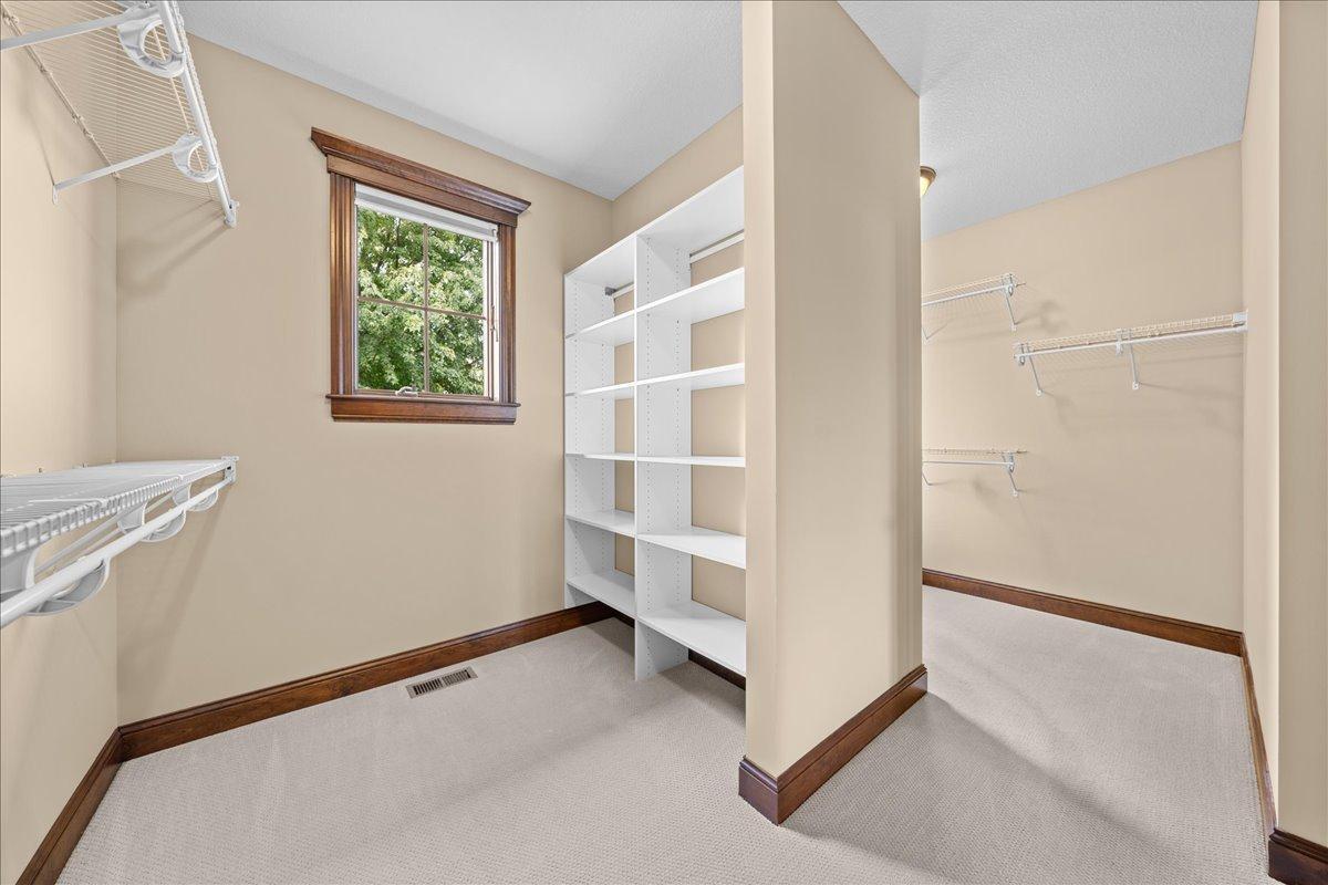Primary walk-in-closet.