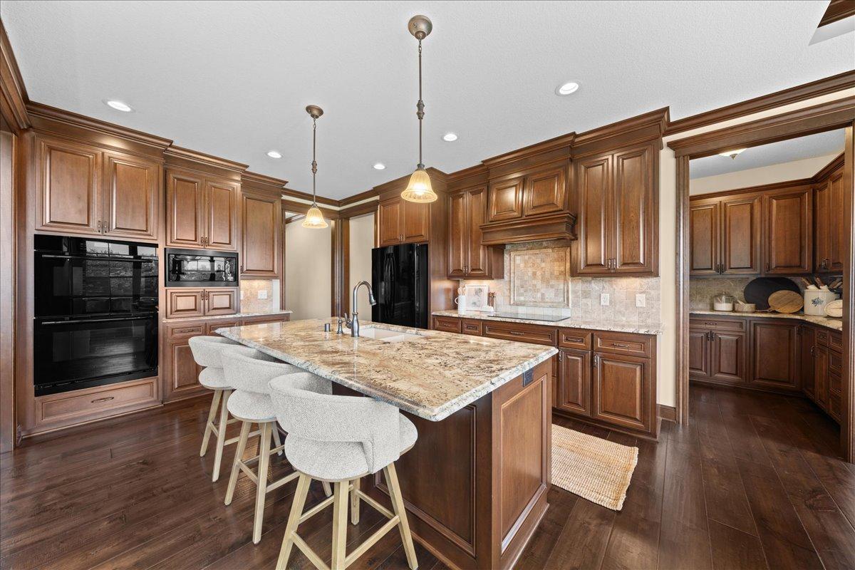Large kitchen with plenty of cherry cabinetry.