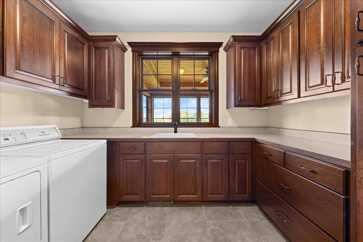 Plenty of storage and counter space in laundry room.