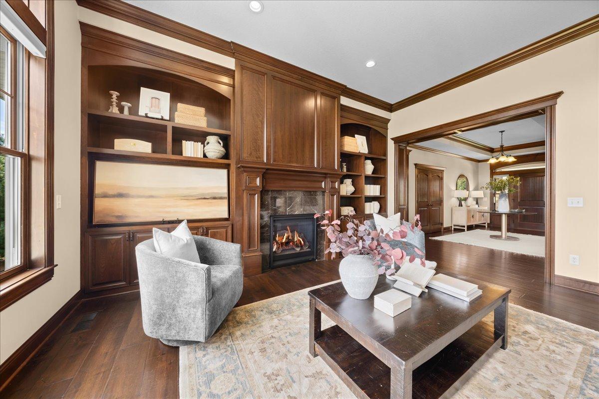 Gorgeous custom built-ins surrounding fireplace.