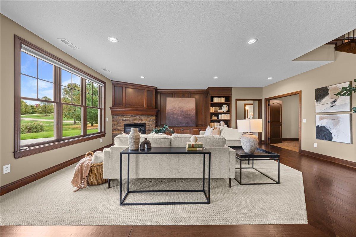 Family room with built-in entertainment center and fireplace.