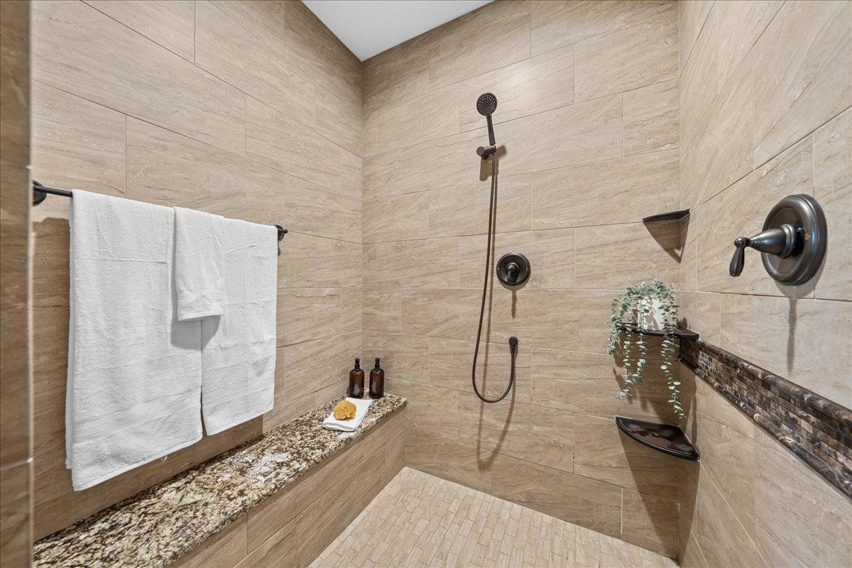 Walk-in-shower with seating.