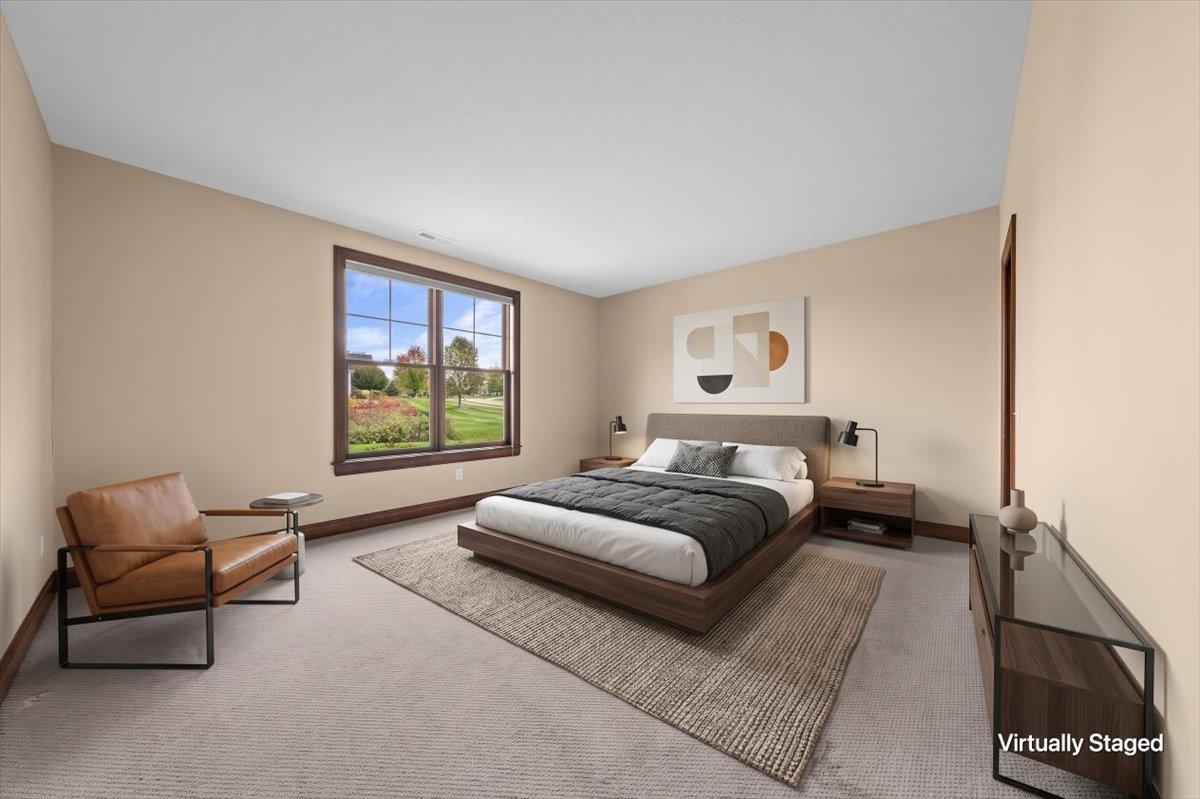 Bedroom in lower level virtually staged.