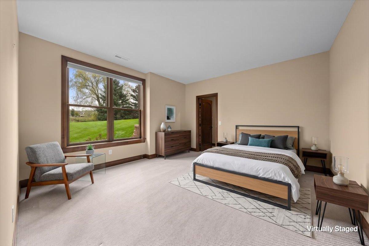 Bedroom 2 staged in lower level.