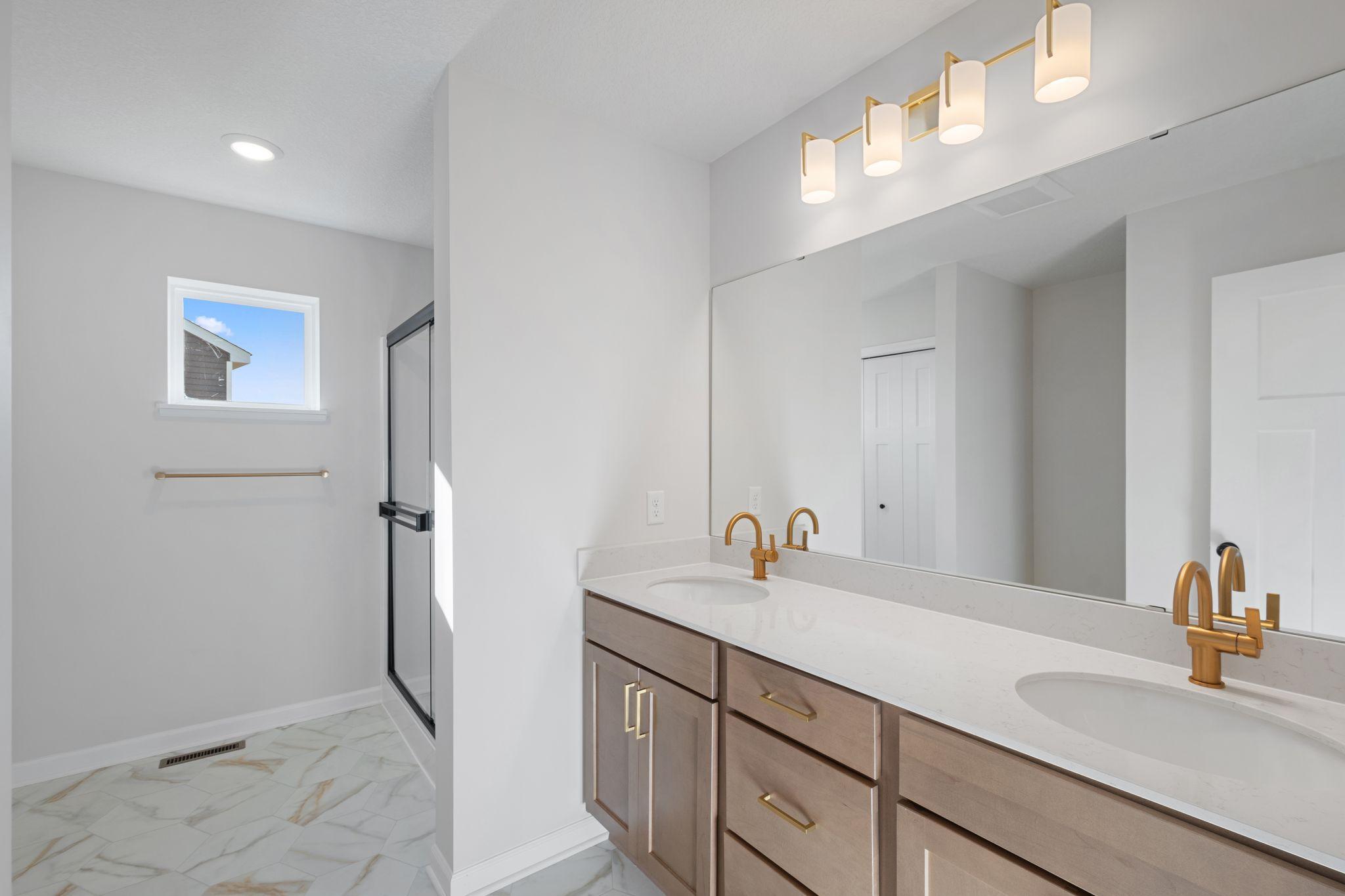 Owner's Bath; Photos of a previously built home. Finishes may vary.