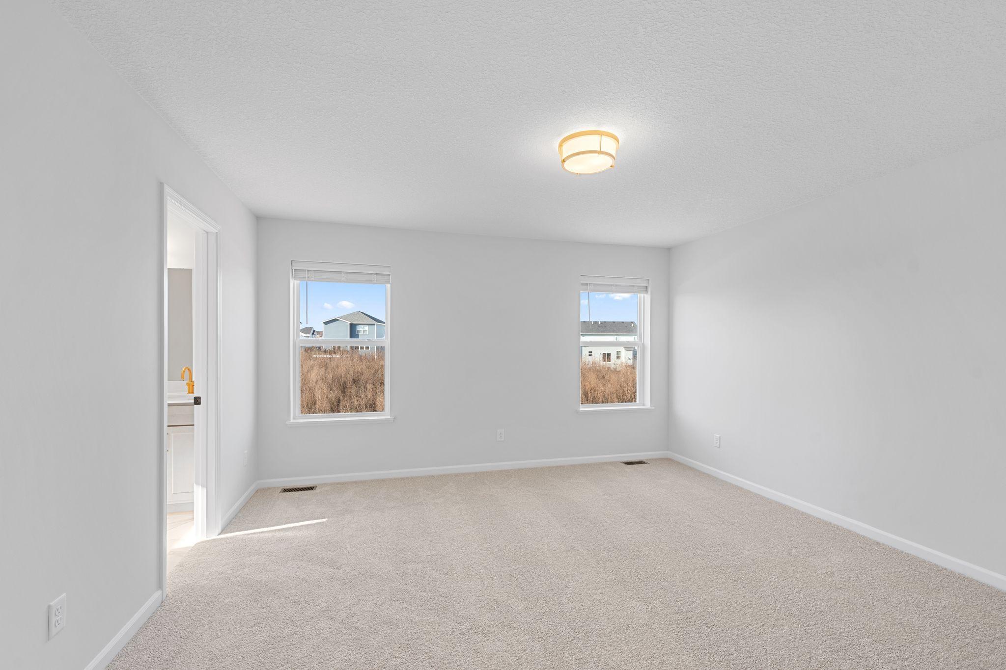 Owner's Suite; Photos of a previously built home. Finishes may vary.