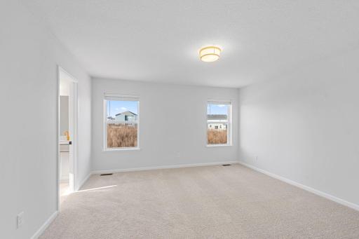 Owner's Suite; Photos of a previously built home. Finishes may vary.