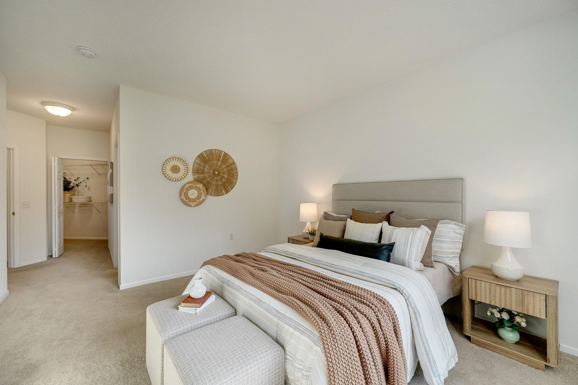 Primary suite with a walk-in closet and full bathroom