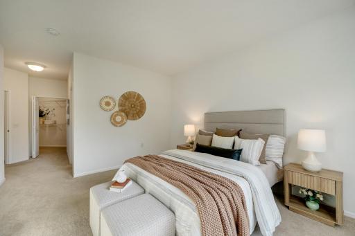 Primary suite with a walk-in closet and full bathroom