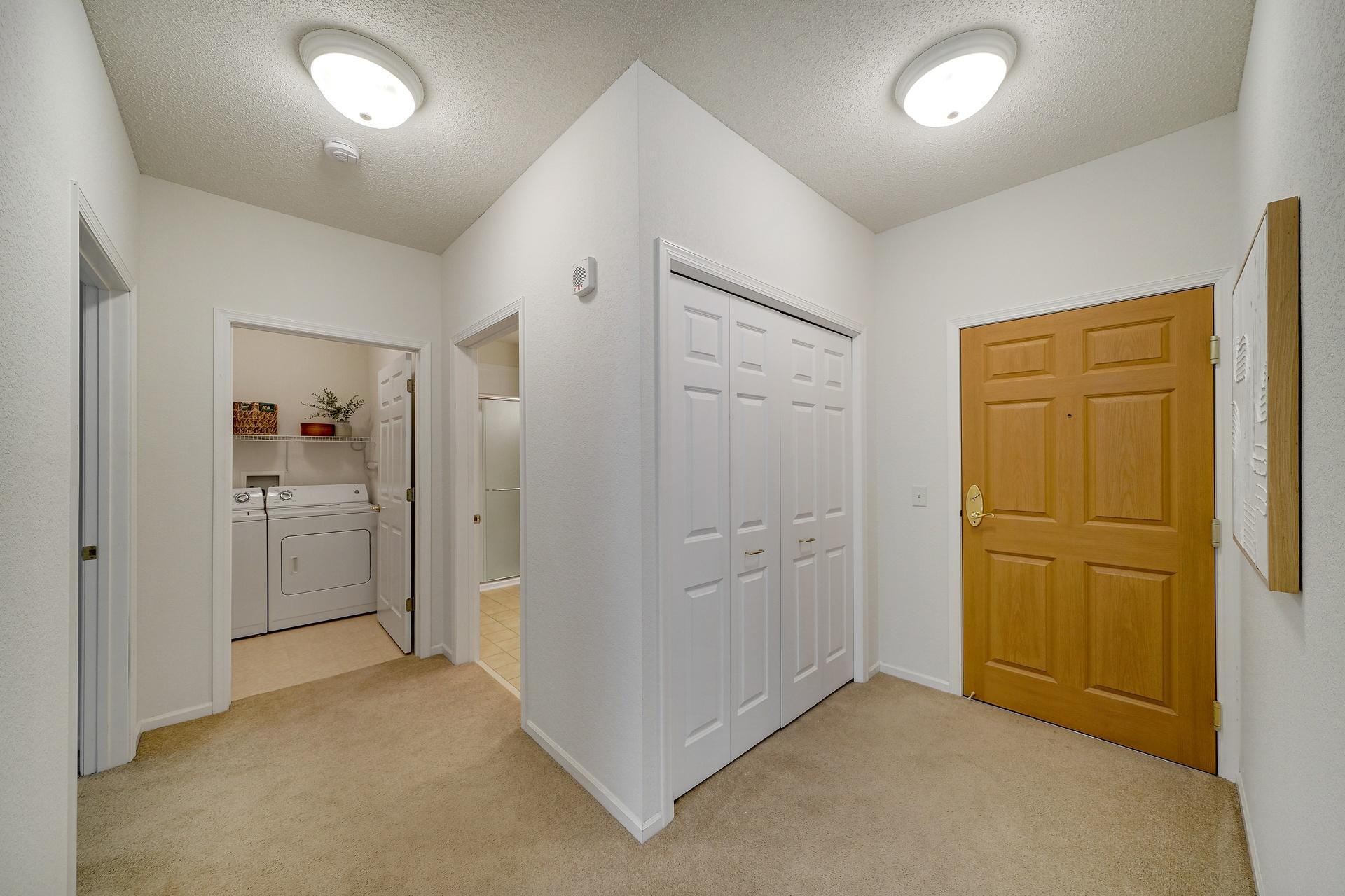 Welcoming foyer with coat closet