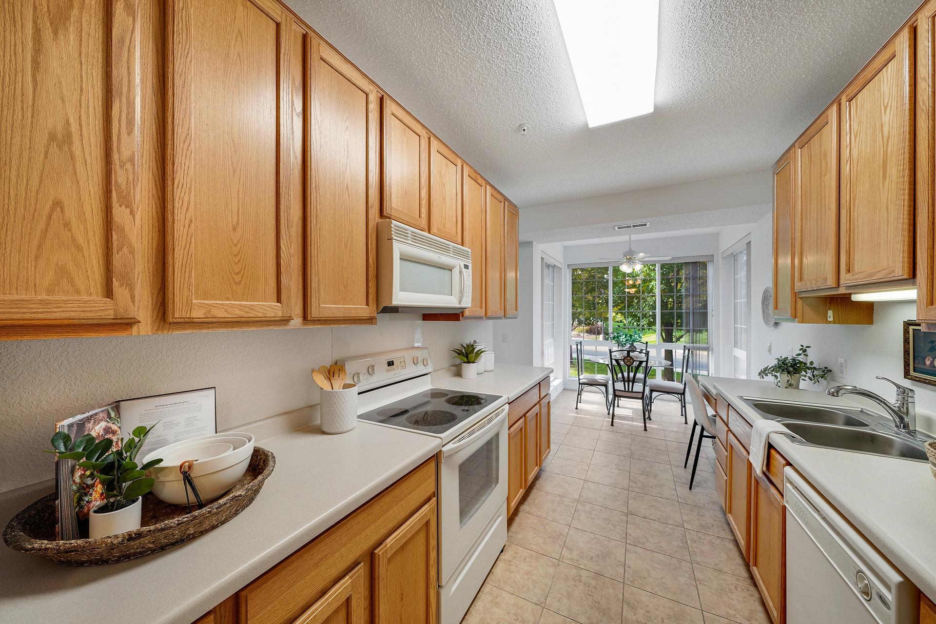 Galley style kitchen with plenty of cabinets and workspace