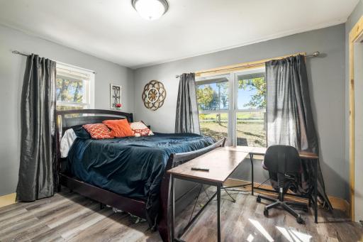 Generous bedroom space with multiple windows providing great natural light and views of the property.