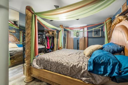 A spacious bedroom with dramatic details and plenty of room for substantial furniture.