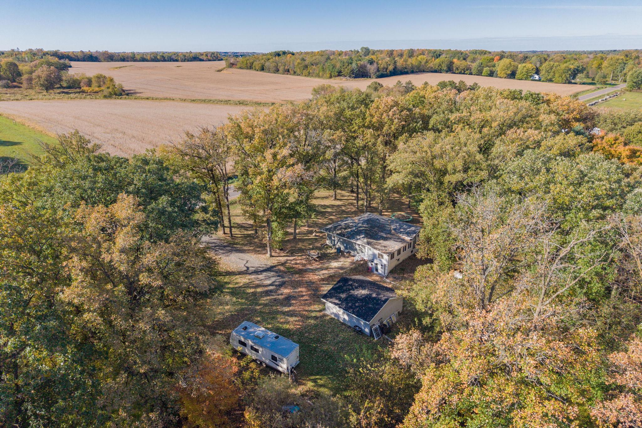 From above, you can really appreciate the setting: approximately one acre, mature trees, a detached garage and plenty of outdoor space to enjoy.