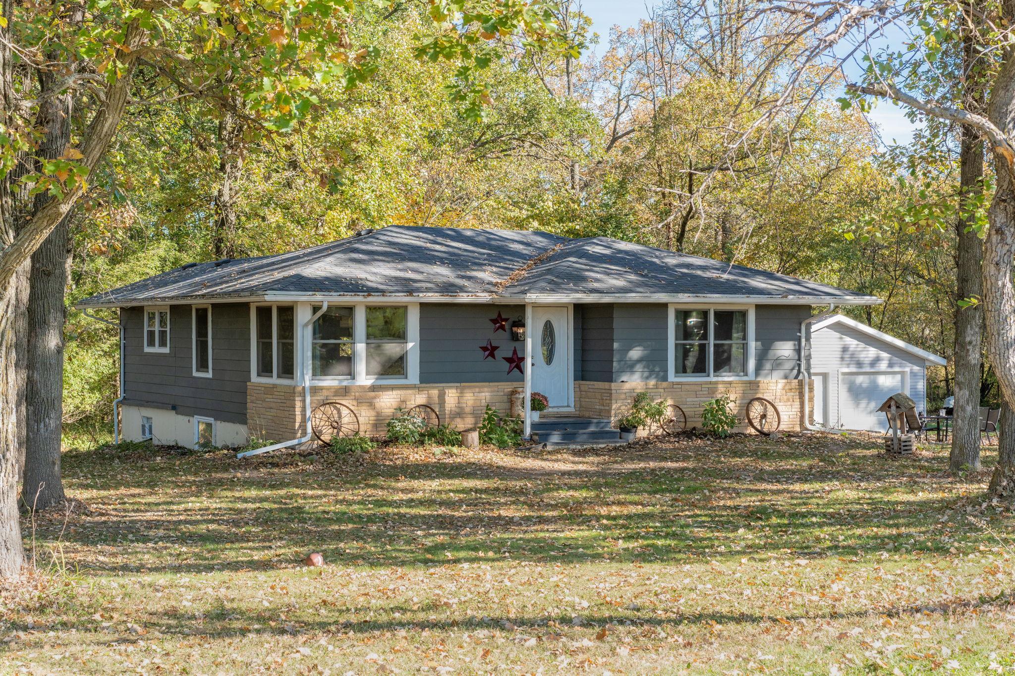 Welcome home! Set on approximately one acre surrounded by mature trees, this home offers space, privacy and a peaceful country setting.