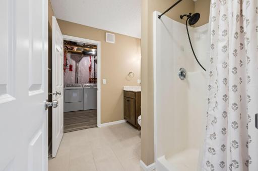 Primary 3/4 Main Floor Bath w/ access to Laundry Room.