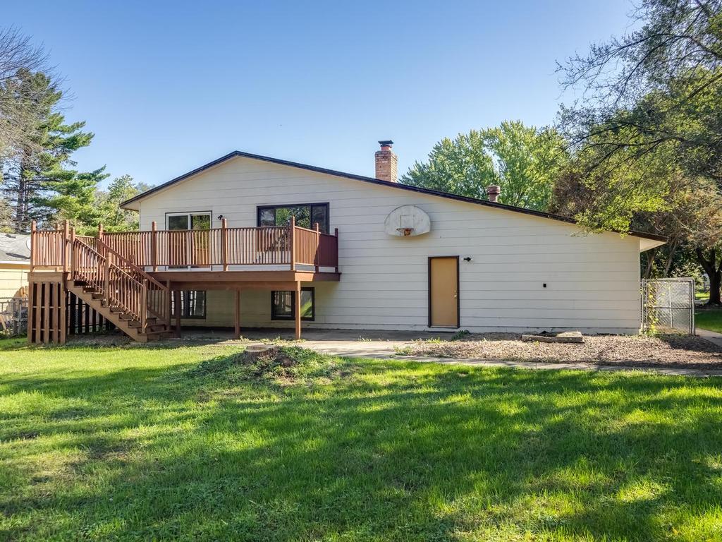 Large fenced backyard. Bottom door accesses the garage. Former owner had a doggy door and outside kennel right side of home .