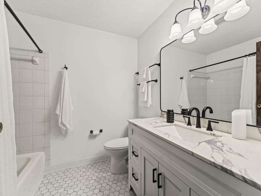 Main floor full bath with updated bath/shower fixture too.