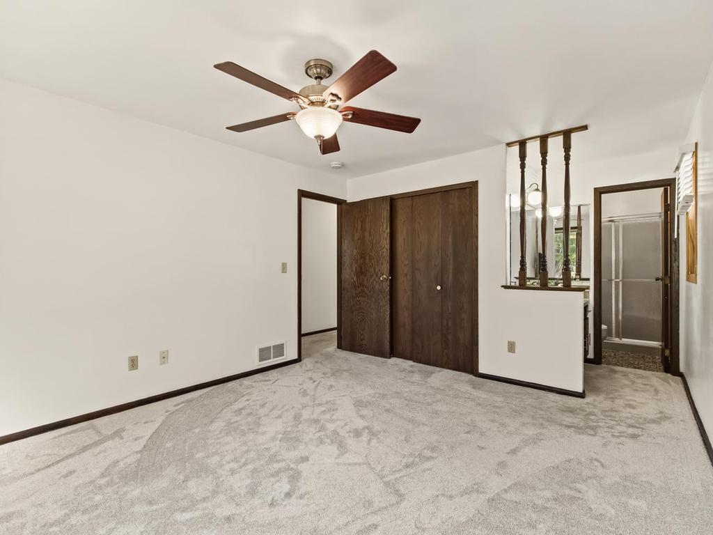 Main floor primary bedroom with new carpet installed last year 2022. Ceiling fan to keep you cool during summer