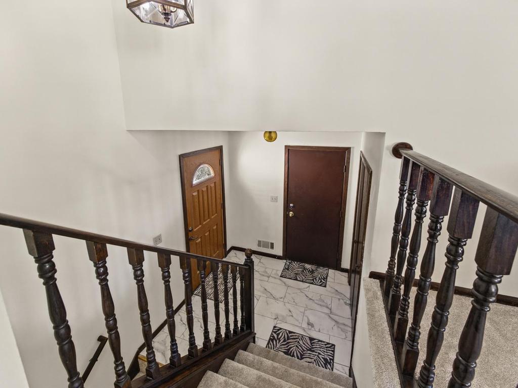Spacious foyer with coat closet . New front door 2022.