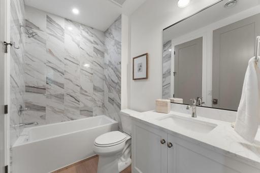 Full Bath with Marble-Look Tile - Not Actual Home, Photos of Model with the Same Layout