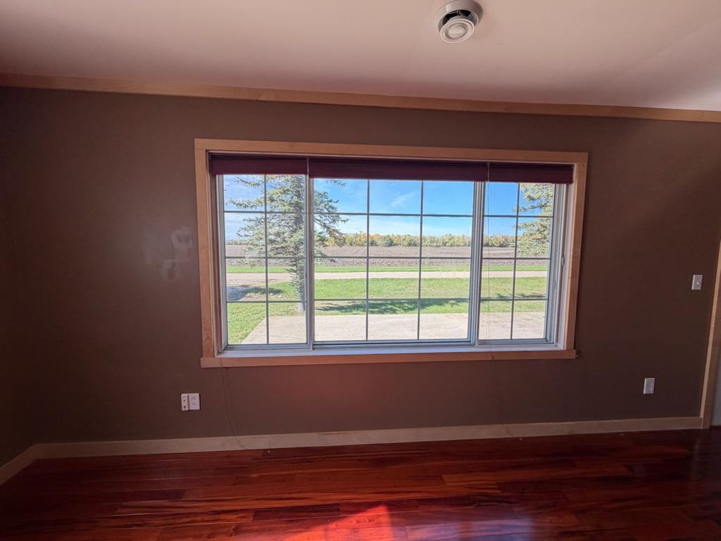 Front picture window to open green space