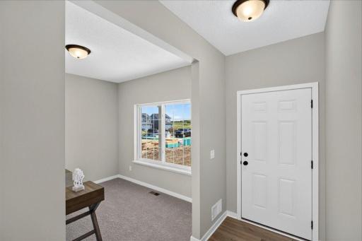 PHOTO OF A DIFFERENT HOME WITH SIMILAR PLAN AND FINISHES.