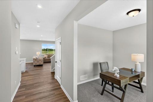 PHOTO OF A DIFFERENT HOME WITH SIMILAR PLAN AND FINISHES.