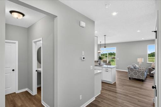 PHOTO OF A DIFFERENT HOME WITH SIMILAR PLAN AND FINISHES.