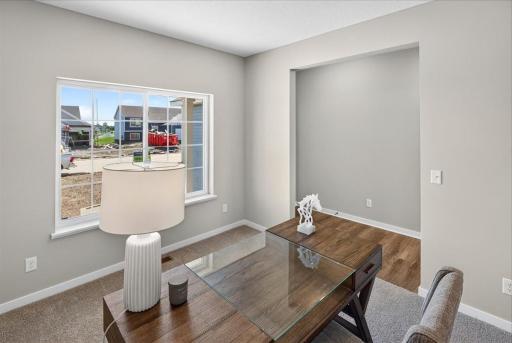 PHOTO OF A DIFFERENT HOME WITH SIMILAR PLAN AND FINISHES.