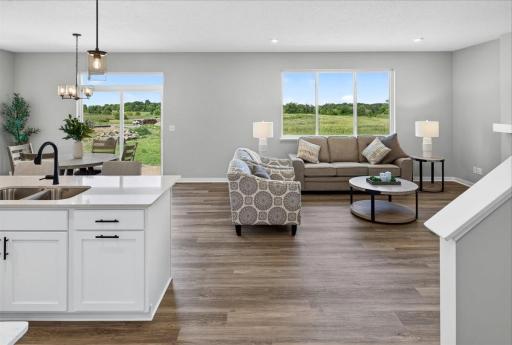 PHOTO OF A DIFFERENT HOME WITH SIMILAR PLAN AND FINISHES.