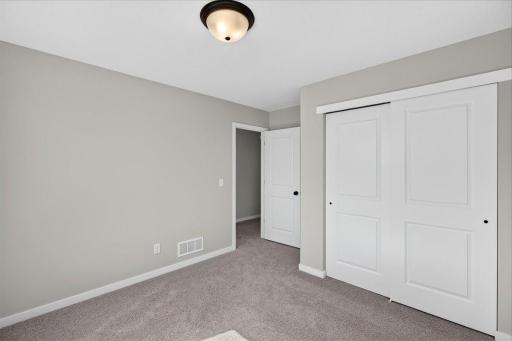 PHOTO OF A DIFFERENT HOME WITH SIMILAR PLAN AND FINISHES. Bedroom 3.