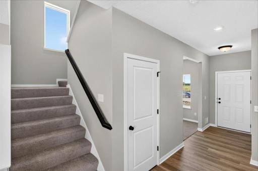 PHOTO OF A DIFFERENT HOME WITH SIMILAR PLAN AND FINISHES.