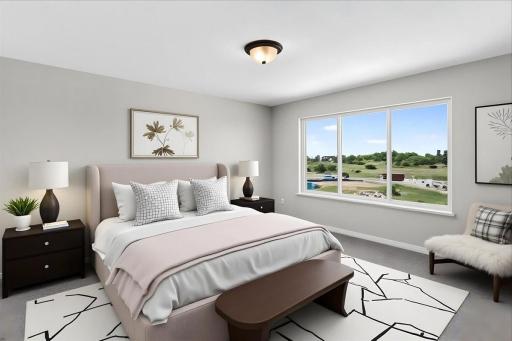 PHOTO OF A DIFFERENT HOME WITH SIMILAR PLAN AND FINISHES VIRTUALLY STAGED. Primary Suite.