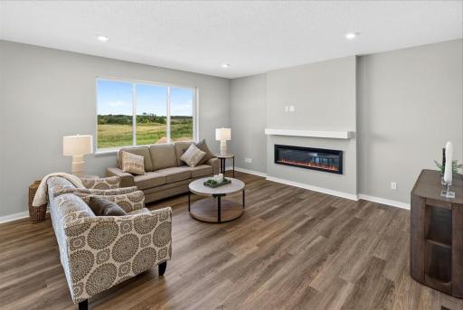 PHOTO OF A DIFFERENT HOME WITH SIMILAR PLAN AND FINISHES.